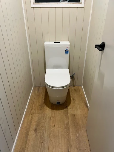 New toilet installation with VJ panel walls